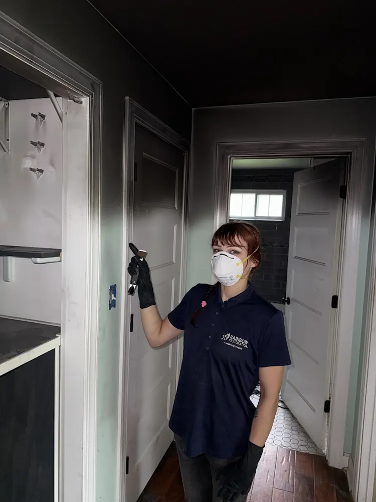 Bay State Water & Fire Restoration technician in protective gear on a job in Boston